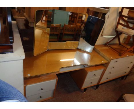 A 4' 1" 1960`s G-Plan light oak and part painted kneehole dressing table with triple mirror, shaped top, frieze drawer and fo