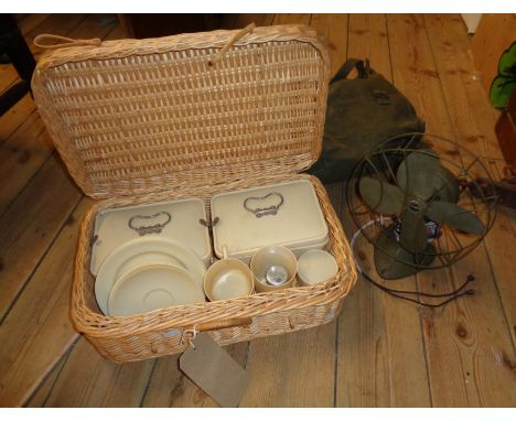 A green canvas satchel containing a vintage Handy Breeze electric table fan - sold with a wicker picnic hamper with white Ban