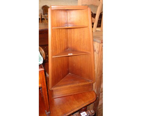 A 19" retro teak and mixed wood freestanding three shelf corner unit of tapered design