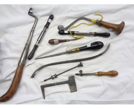 A box of tools including circular spoke shaves, Archimedes drill, sabotiers drill, saddler's adjustable bevel creases, leathe