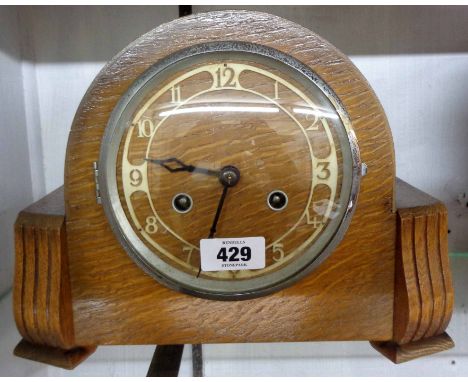 A vintage polished oak cased mantel clock, eight day gong striking movement
