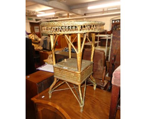 A vintage cane work and woven plastic occasional table with locker undertier - later painted gilt finish