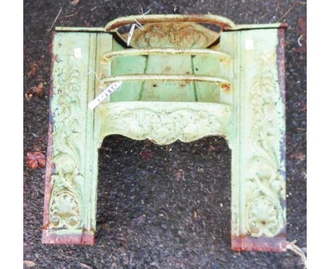 A Victorian cast iron fire grate