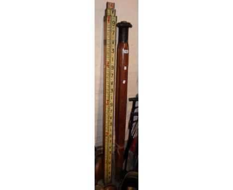 A vintage theodolite tripod and measuring stick 