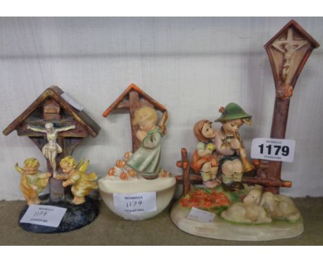 Two Hummel religious figures and a Goebel figure similar