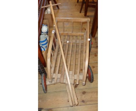 A vintage child's toy wooden cart