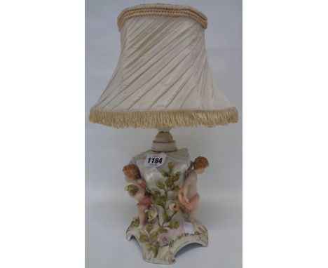 A German porcelain figural pedestal as a table lamp