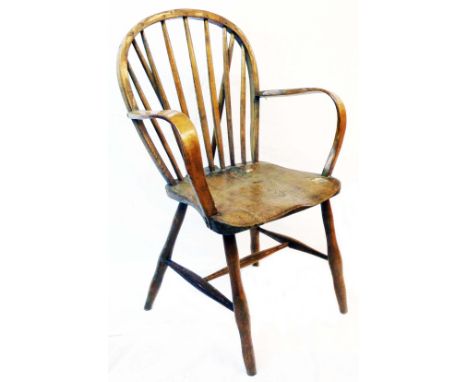 An antique country hoop stick back elbow chair with solid elm seat, set on simple turned supports