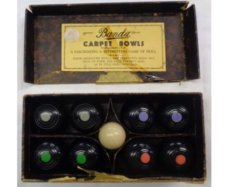 A boxed set of vintage Banda carpet bowls