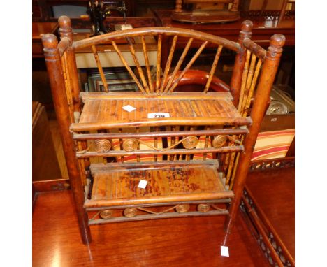 A 14" late 19th Century freestanding bamboo and cane two shelf unit with slatted surfaces