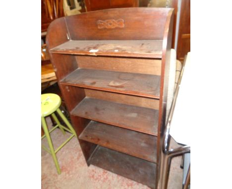 A 24" early 20th Century five shelf open bookcase with blind fretwork decoration to top