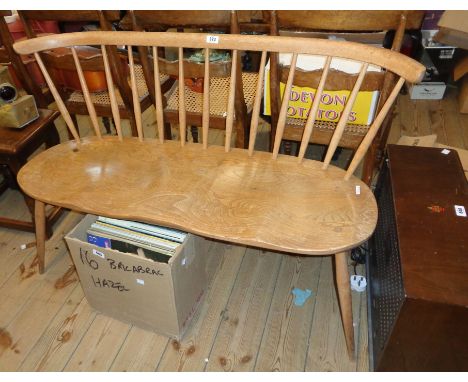 A 3' 8" vintage Ercol light elm window seat with spindle back and moulded solid seat, set on simple turned supports - finish 