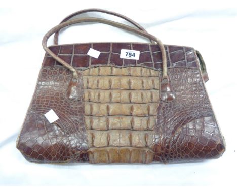 A vintage crocodile skin handbag