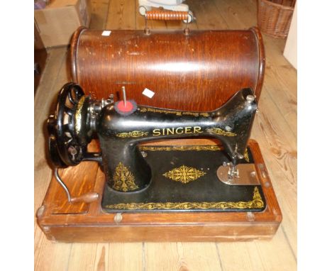 A vintage cased Singer sewing machine