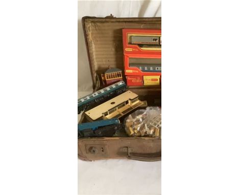 Model railway interest to include carriages and other Hornby items -One suitcase of Triang model railways, play worn as found