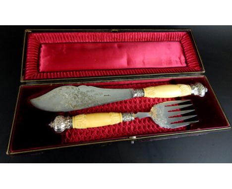 A pair of late 19th/early 20thC silver plated fish servers, each with carved ivory handles, silver collars, in a fitted case