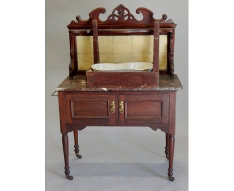 Two items of 19thC furniture, a mahogany washstand, with towelled back, marble top and two panelled doors and a bidet with sc