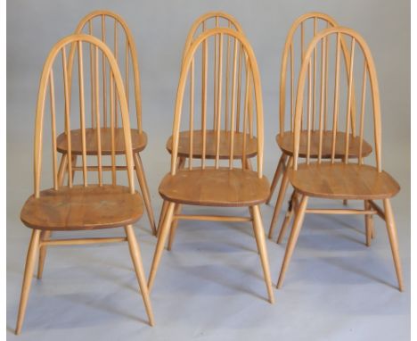A set of six Ercol spindle back kitchen chairs, each with a solid seat, on turned legs.