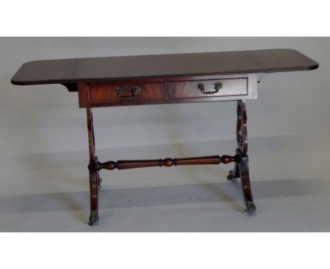 A reproduction Regency style mahogany and ebony strung sofa table, with two frieze drawers on sabre legs, 89cm wide.