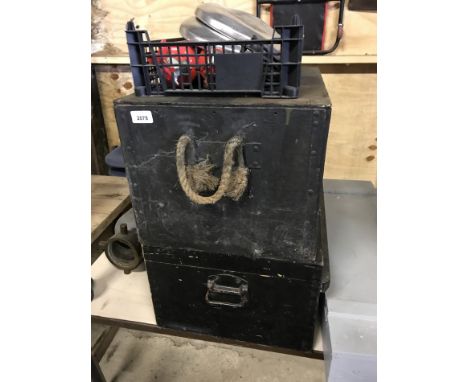 Two black painted tool or ammunition boxes, together with fire extinguishers and hub caps.