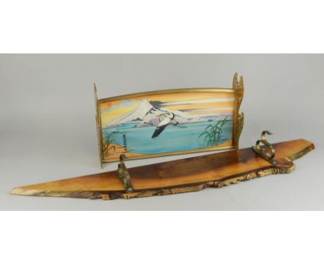 Two modern sword stands, one bearing an oriental panel painted with a crane by J Heald, the other wooden with brass clips.