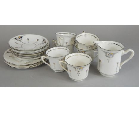 A Shelley early 20thC part tea service, printed with stylized flowers, etc.