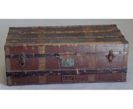 An early 20thC stained pine and metal bound trunk, 94cm wide, (AF)