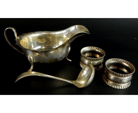 A collection of small silver etc., to include a sauce boat, a small ladle and two plated napkin rings, weighable silver 4½oz