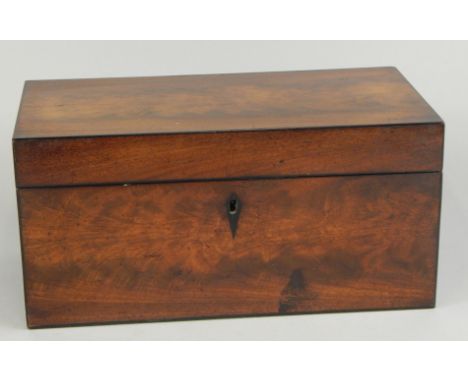 An early 19thC mahogany tea caddy, with ebony strung borders, the hinged lid enclosing two lidded divisions and a central eng