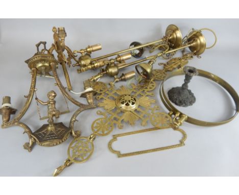 A quantity of metalware, to include a church brass cross shaped candelabra, a gilt metal chandelier mounted with a putto on a