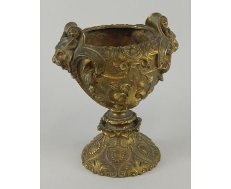 A French gilt bronze vase or lamp base, cast with scrolls, leaves and with lion mask handles, 23cm high