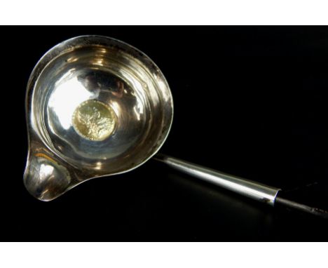 A late 18th/early 19thC silver toddy ladle, inset with a 1787 gilt coin, with whale bone handle, marks indistinct