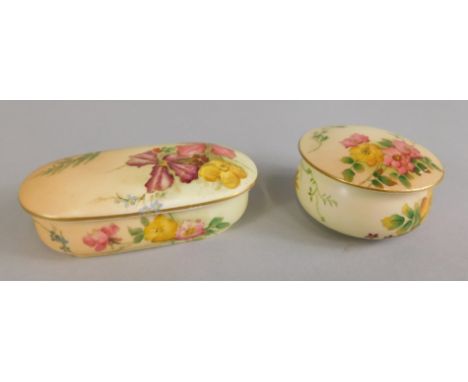 Two Royal Worcester blush ivory boxes and covers, one ovoid painted with flowers, the other circular and similarly decorated.