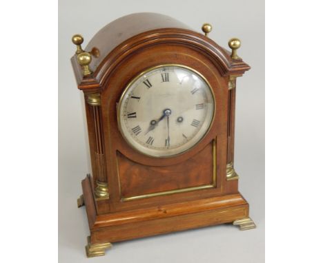 A late 19th/early 20thC mahogany and brass mantel clock, the silvered dial stamped Asprey, London, the brass movement stamped