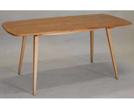 An Ercol light elm kitchen table, on square tapering legs, the top 74cm x 147cm.