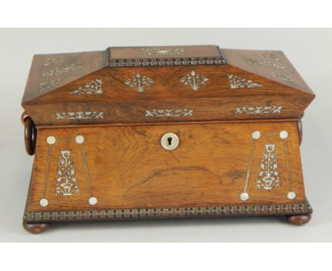 An early Victorian rosewood and mother of pearl inlaid sarcophagus shaped tea caddy, the hinged lid enclosing an interior wit
