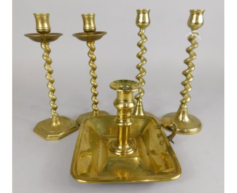 A collection of items, to include two pairs of brass candlesticks, and a chamber stick.