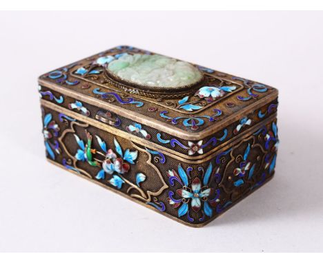 A CHINESE SILVER, ENAMEL &amp; JADE LIDDED BOX, the top inset with a carved floral jade floral pendant, with raised enamel fl