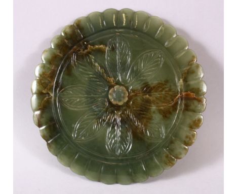 A CHINESE CARVED JADE FLOWER FORMED DISH, with a gilt ring interior, 18cm