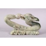 A CHINESE CARVED SOAPSTONE FIGURE OF A DRAGON & PEARL, the dragon intertwined chasing the pearl
