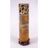A LARGE CHINESE CARVED SOAPSTONE CYLINDRICAL SEAL WITH ADRAGONS, the cylindrical body with a greek