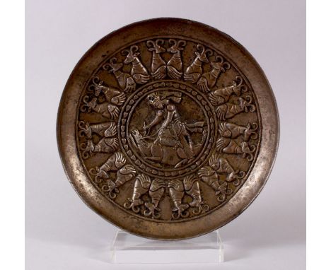 AN EARLY PERSIAN, POSSIBLY SASSANIAN&nbsp;TWO LAYERED REPOSE SILVER DISH, the central panel depicting a hunter and stag withi