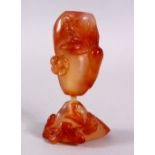 TWO CHINESE CARVED AGATE SNUFF BOTTLES, One carved with funghi, 6cm the larger carved with gourd