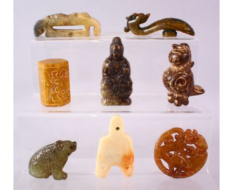 A MIXED LOT OF EIGHT CARVED CHINESE JADE ITEMS, consisting of: A carved jade chilong belt hook, 9cm, A carved jade pendant of