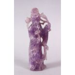 A CHINESE CARVED AMETHYST FIGURE OF GUANYIN, stood holding a scepter and staff, 12.5cm