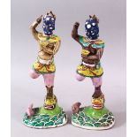 A PAIR OF 19TH CENTURY CHINESE FAMILLE ROSE PORCELAIN GHOST OF QUIXING FIGURES, both stood upon lion