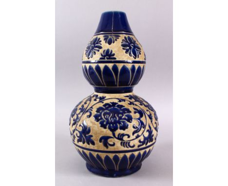 A CHINESE CANTON EXPORT STYLE DOUBLE GOURD PORCELAIN VASE FOR ISLAMIC MARKET, decorated with raised blue enamel of flora &amp