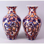 A PAIR OF MEIJI PERIOD IMARI VASES, 26cm high.