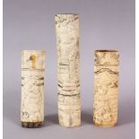 THREE 19TH CENTURY CHINESE CARVED IVORY SWORD / KNIFE HANDLES, each carved with various figures,