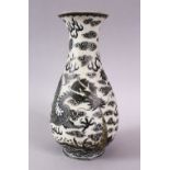 A CHINESE PORCELAIN DRAGON VASE, the dragon amongst stylized clouds and waves, the base with a